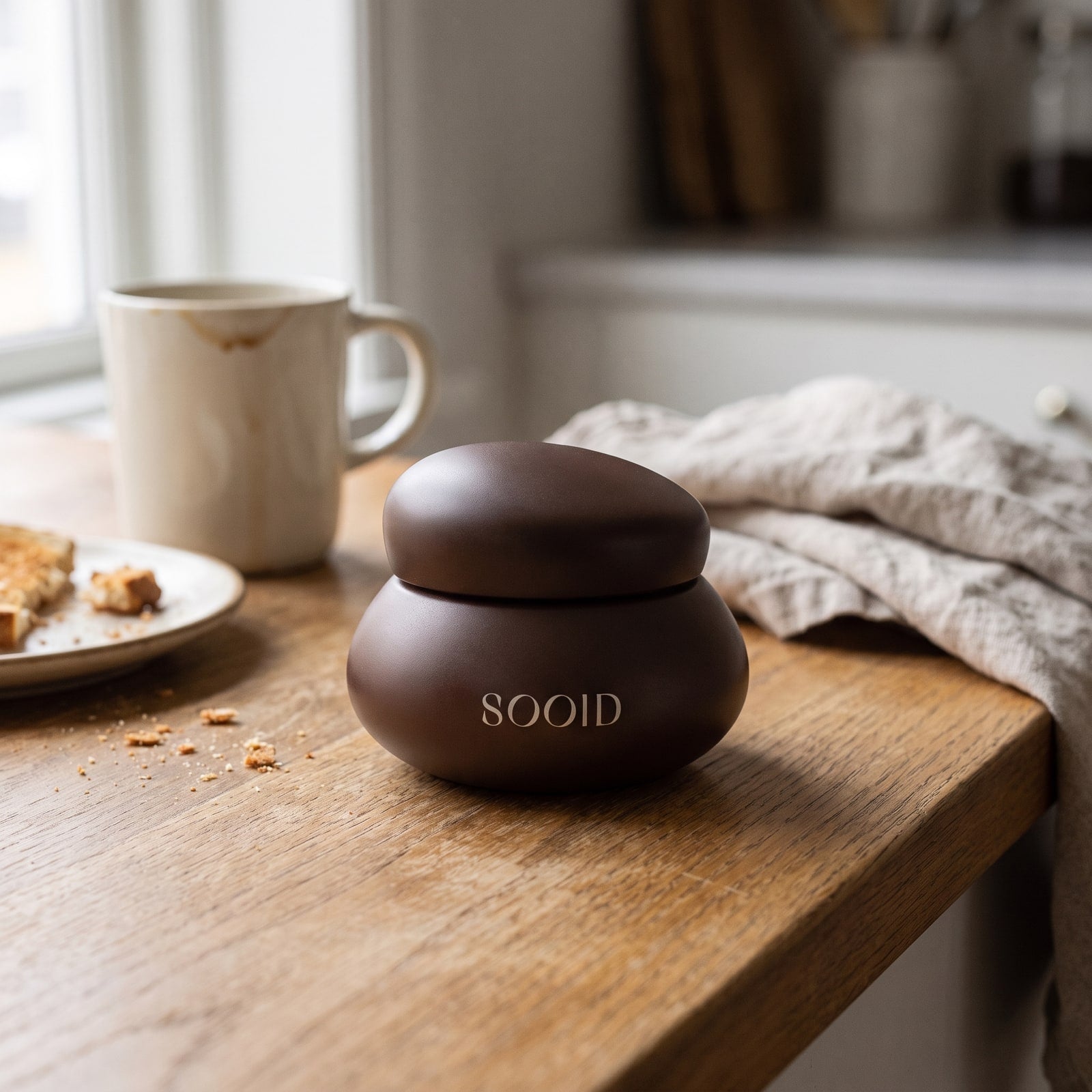 The chocolate-brown SOOID jar, part of a daily routine